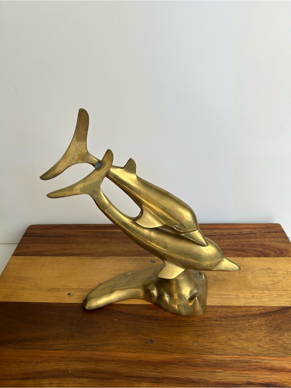 Brass leaping dolphins